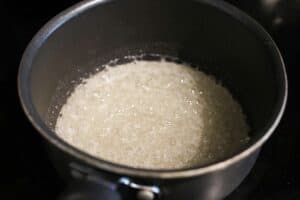 cornsyrup, water and sugar boiling in a saucepan