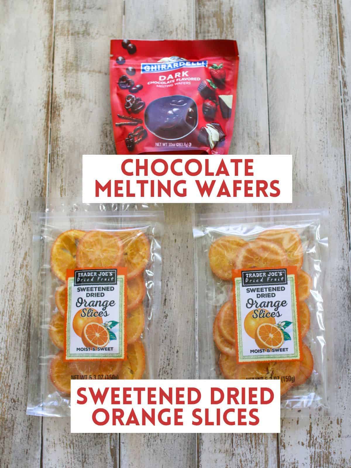 A red bag of chocolate melting wafers and below are two bags of sweetened dried orange slices. Both on a wood background and each labeled with a white rectangle box with dark red text in all caps.